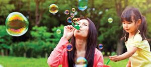 Girl blowing bubbles