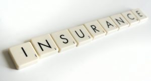 Insurance spelled out in Scrabble letters