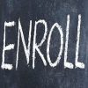 Word "enroll" written in chalk