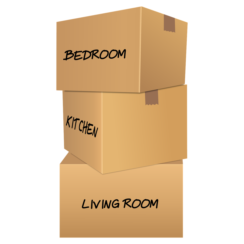 3 stacked cardboard boxes, labeled bedroom, kitchen, and living room.